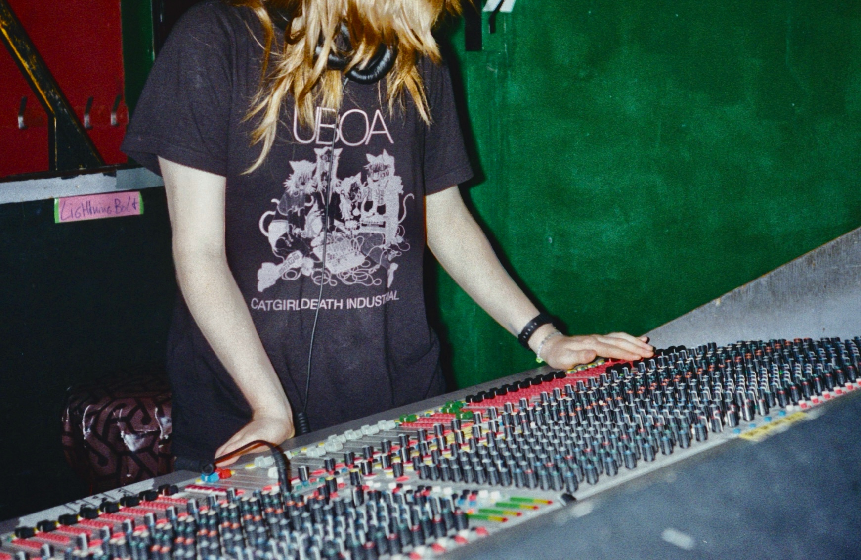35mm photo of Connie working at a soundboard